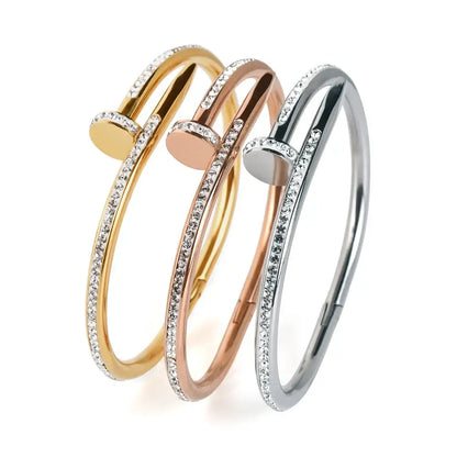 a silver, rose gold and gold variant of a design bracelet next to eachother