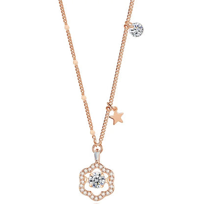 a rose gold necklace with a pendant and a star on a white background