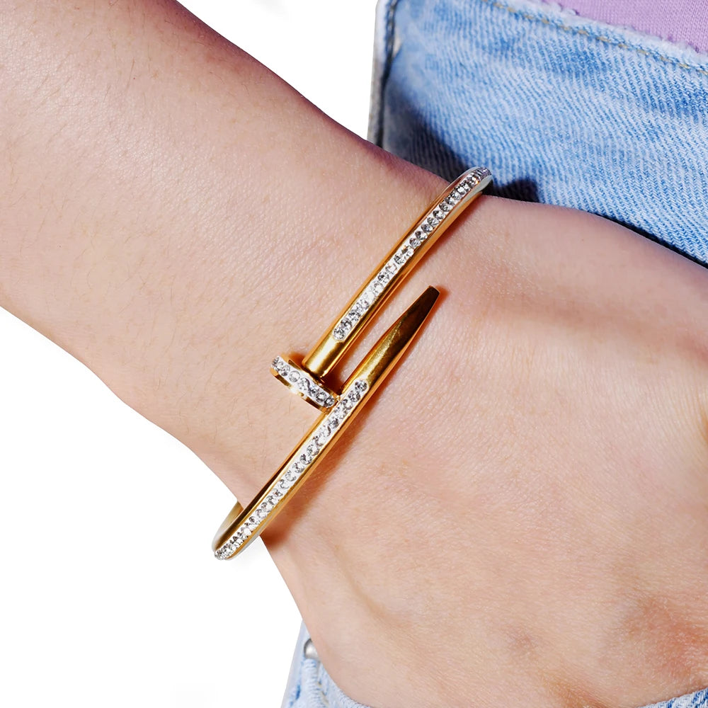 a person wearing a rose gold bracelet