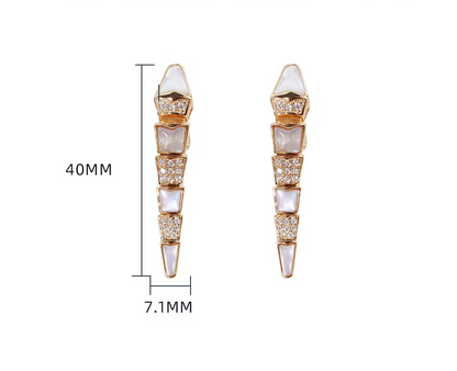 a pair of rose gold earrings with measurements besides them