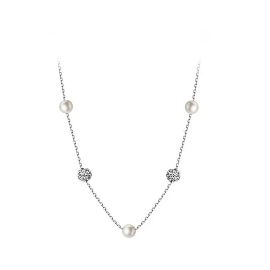 a silver pearl necklace on a white background