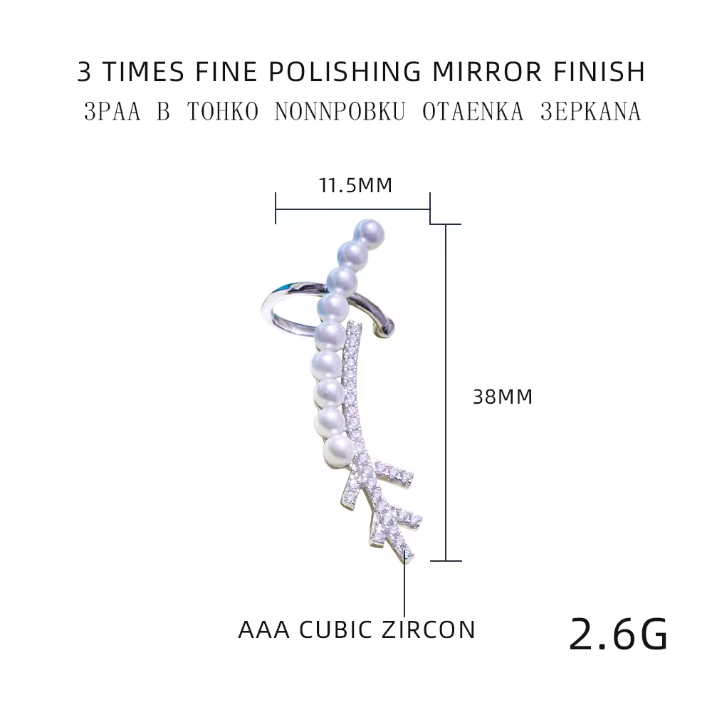a silver earring with measurements besides it