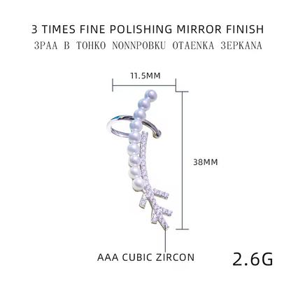 a silver earring with measurements besides it