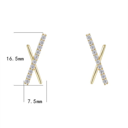 a pair of gold X shaped earrings with measurements besides them
