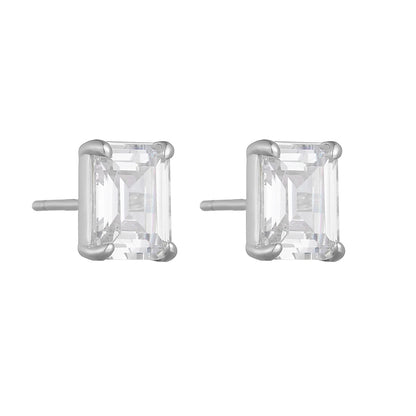 a pair of silver earrings with a square cut stone on a white background