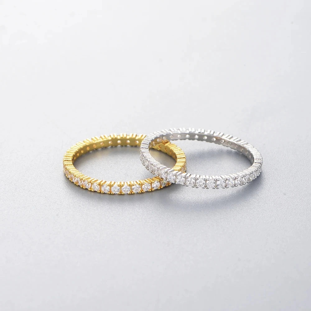 both variants of a ring in gold and silver laying on a white surface