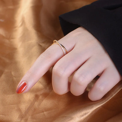 a womans hand with a silver ring on her finger