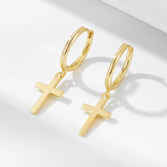 a pair of silver cross earrings