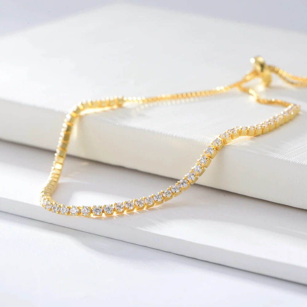 a gold chain with shiny stones on it