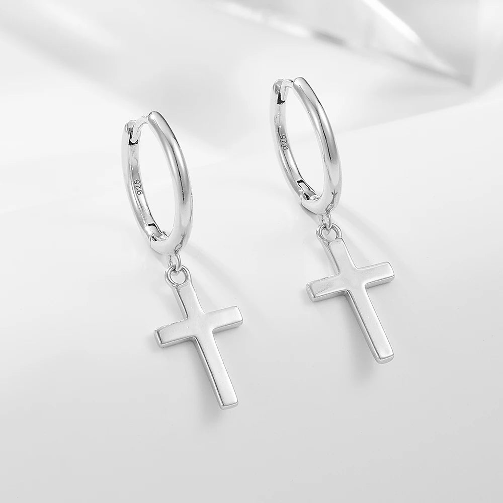 a pair of silver cross earrings