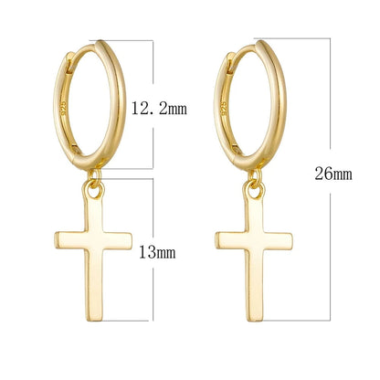 a pair of gold cross earrings with measurements besides them