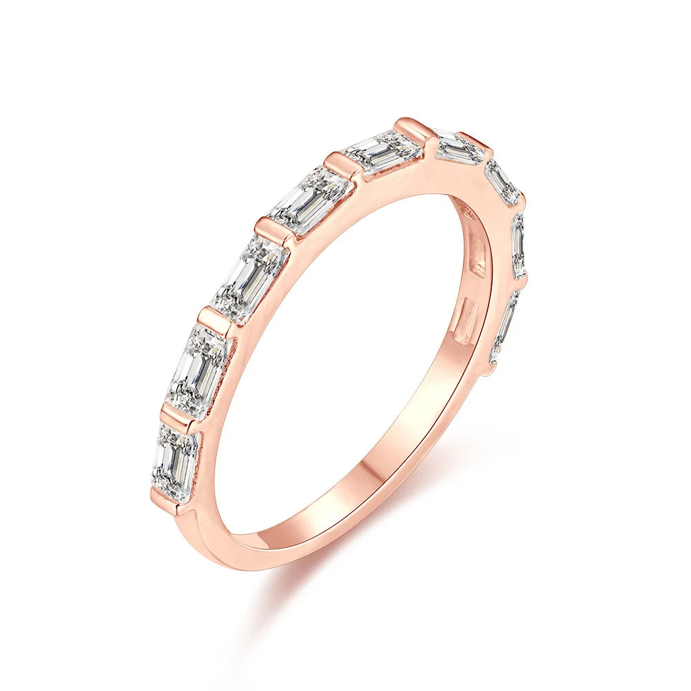 a rose gold ring with a row of rectangle gemstones on it