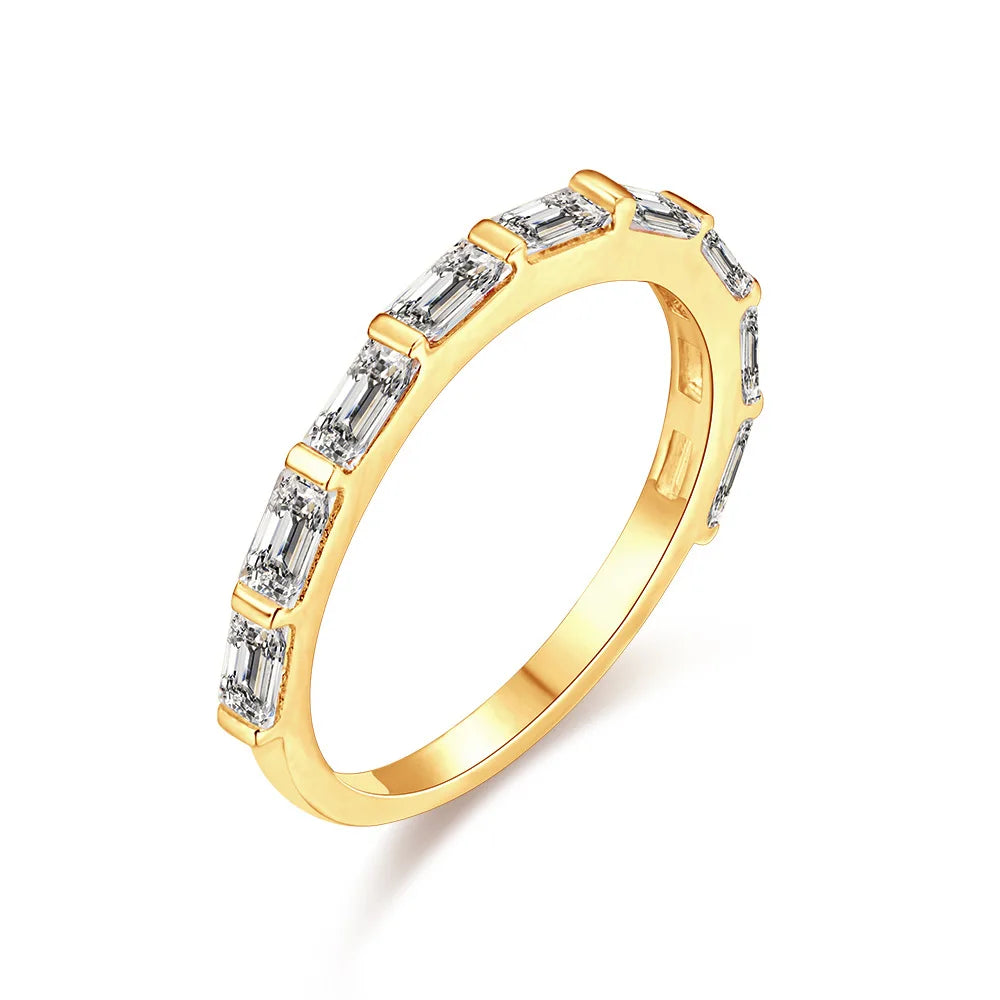 a gold ring with a row of rectangle gemstones on it