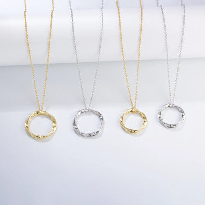 four golden and silver necklaces in different sizes